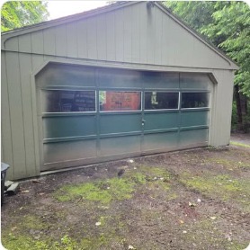 Full-view glass panel garage door on gable building